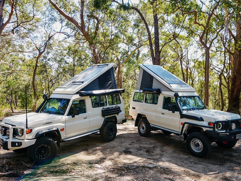 LandCruiser 78 Series side profile with Mulgo pop-top fully extended in the workshop yard