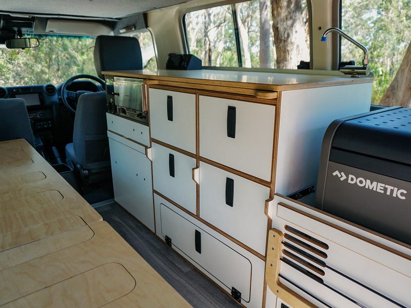 Mulgo fit-out cabinetry inside a LandCruiser Troopy, kitchen drawers open, mid-assembly detail